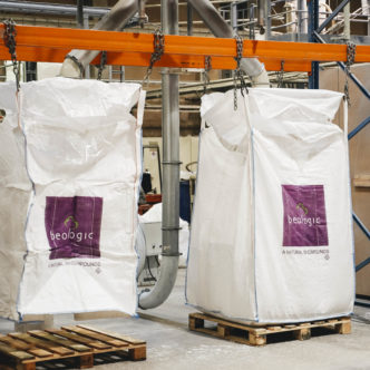 Two big bags with beologic logo on pallets in the production hall